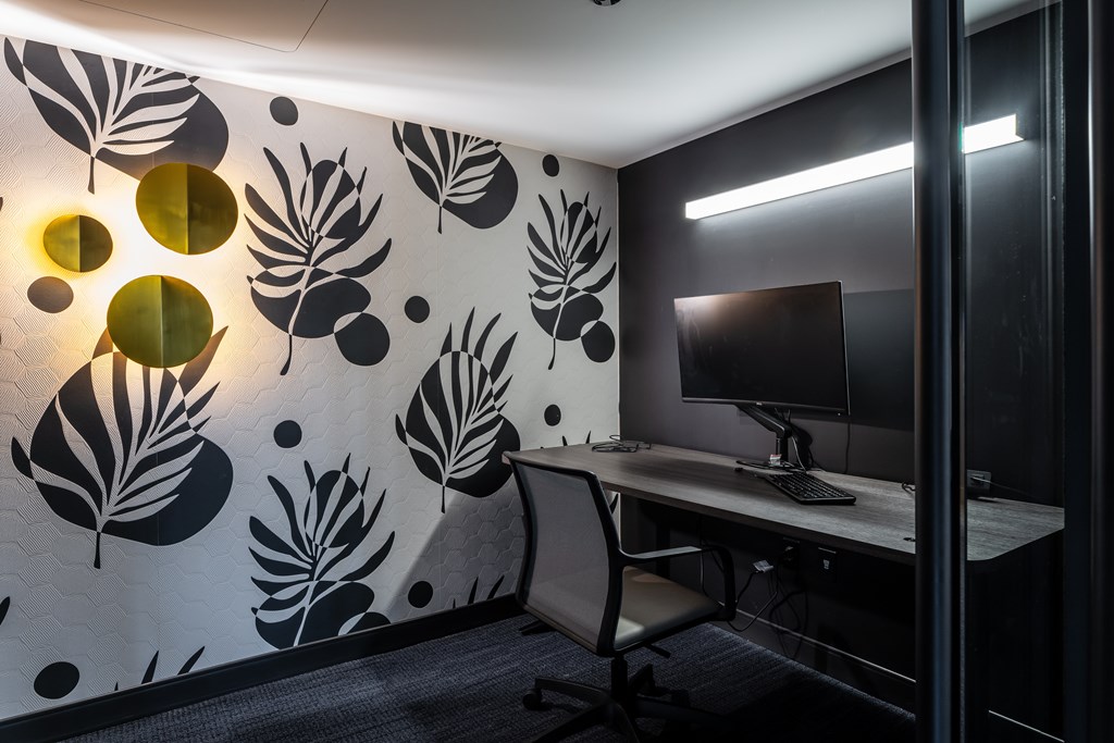 A modern office with a leaf patterned wallpaper and a desk with a computer at Kingsbury Plaza, Chicago, IL, 60654