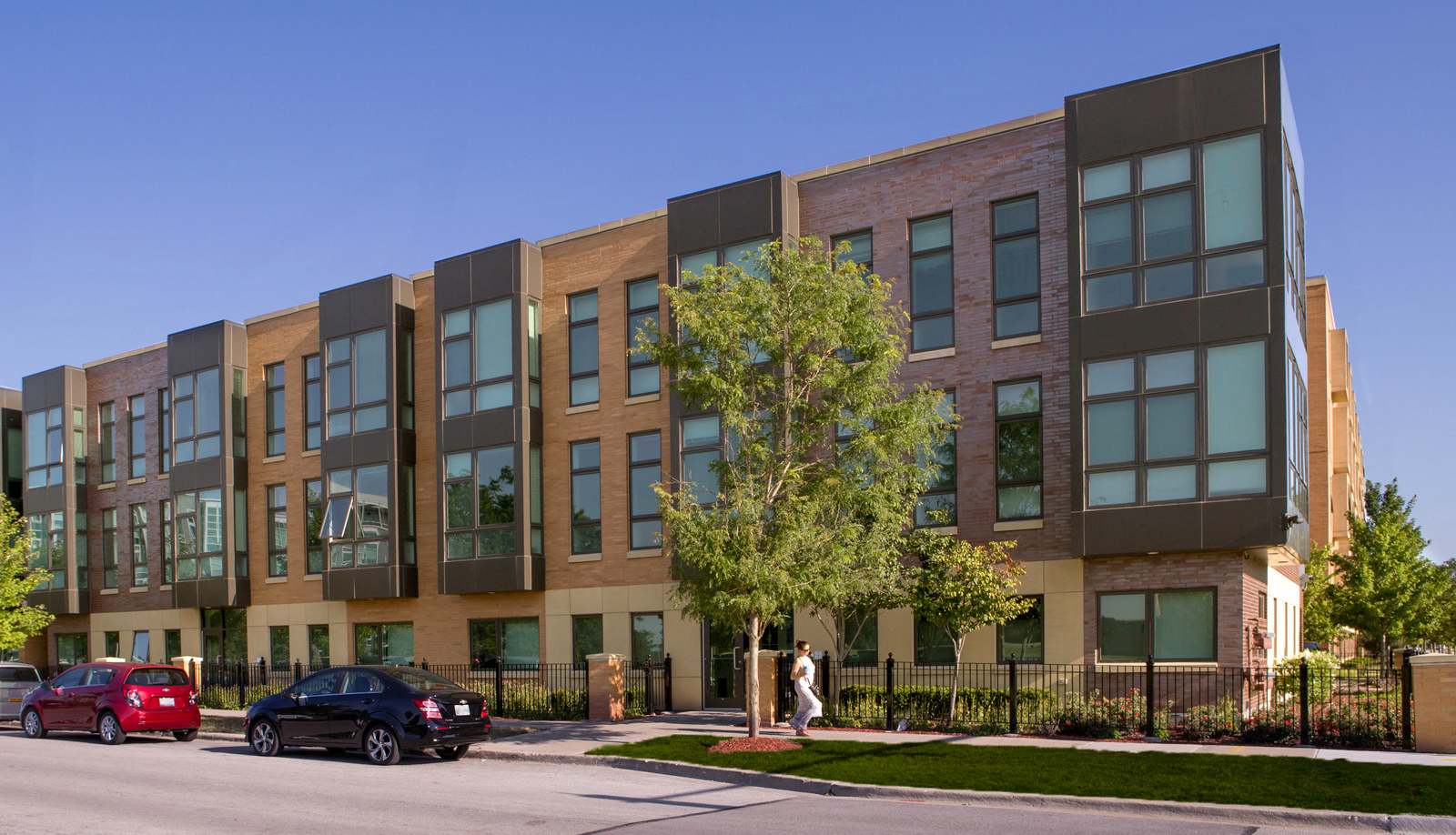 Corner exterior streetview image of one of the Park Boulevard IIB buildings, plus surrounding neighborhood