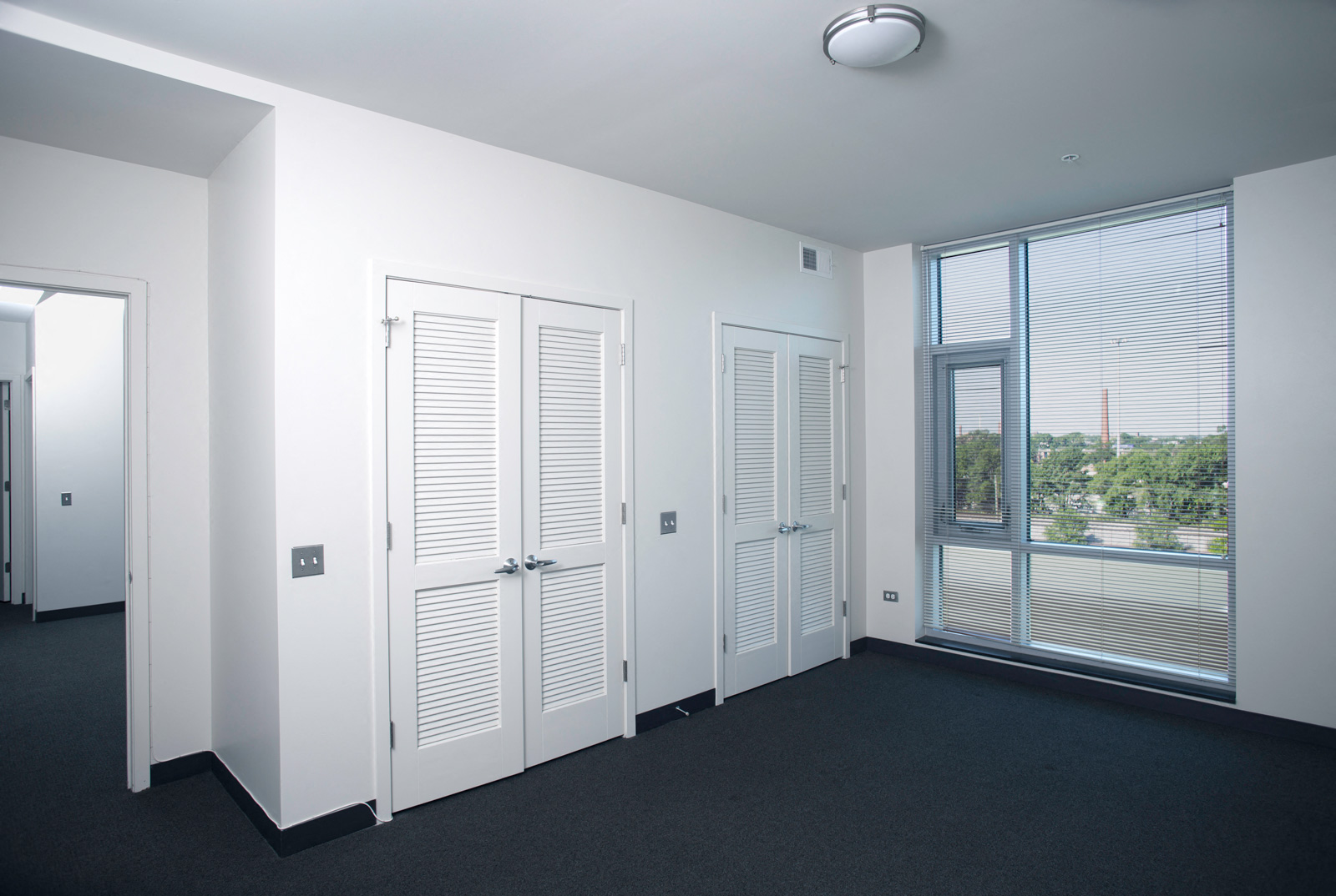 Image of Park Boulevard IIB bedroom with large window and closets.