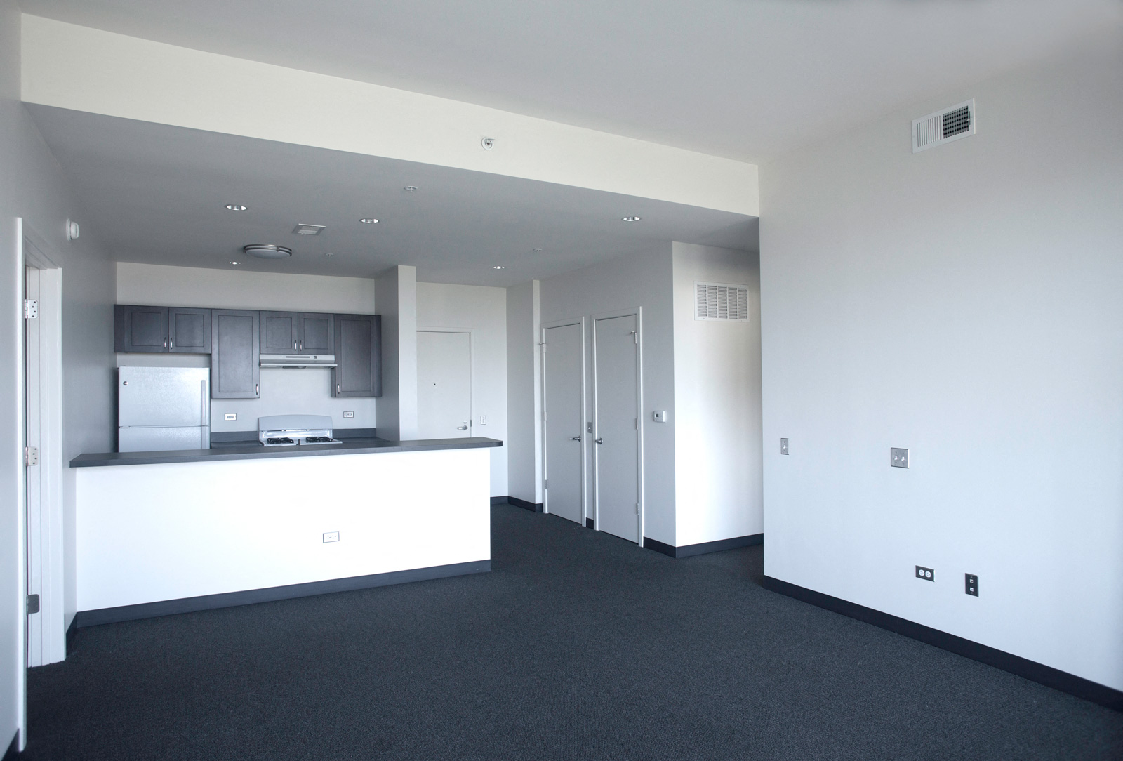 Image of Park Boulevard IIB living room with view of kitchen area and entry way