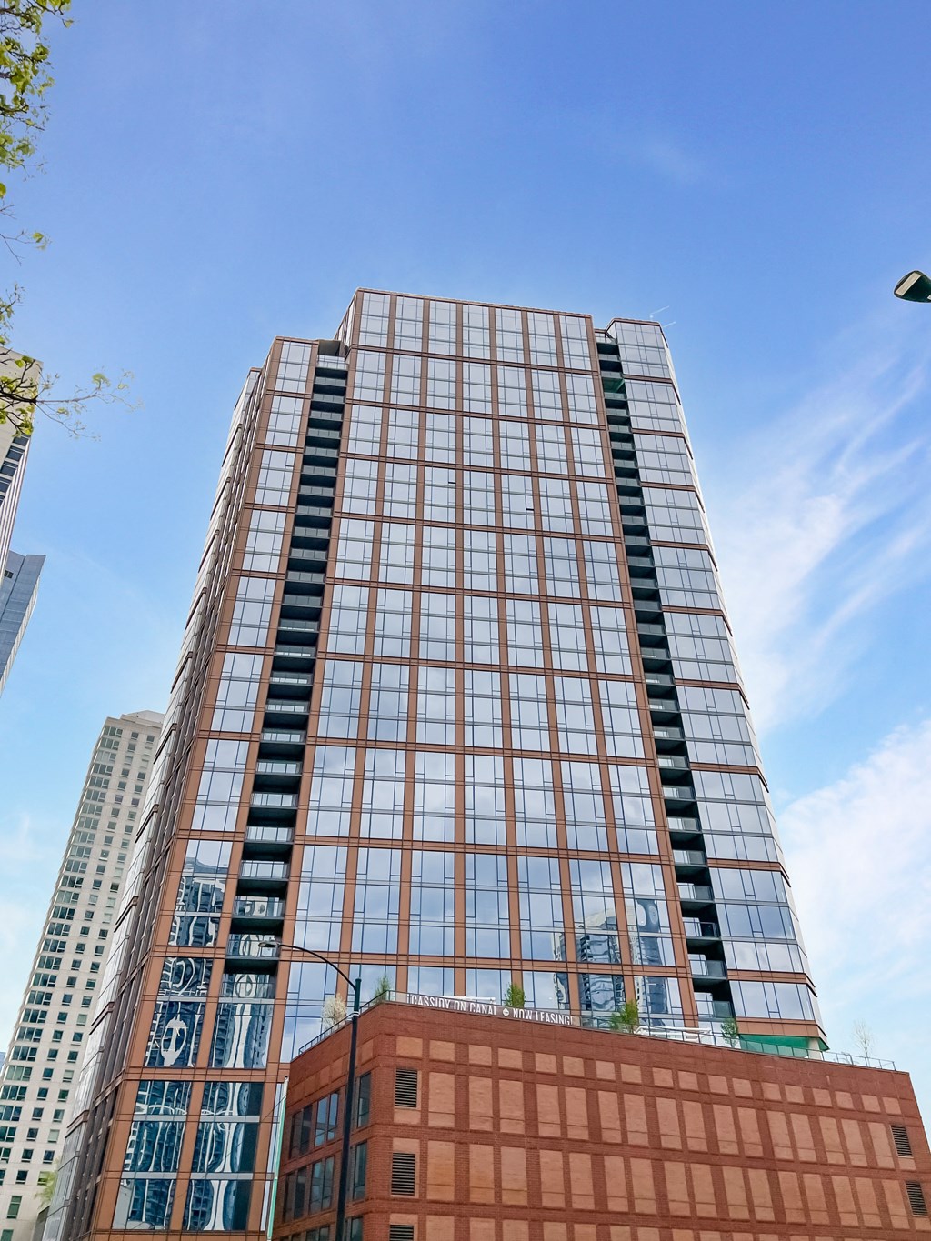 a tall building with a blue sky in the background  at Cassidy on Canal, Chicago