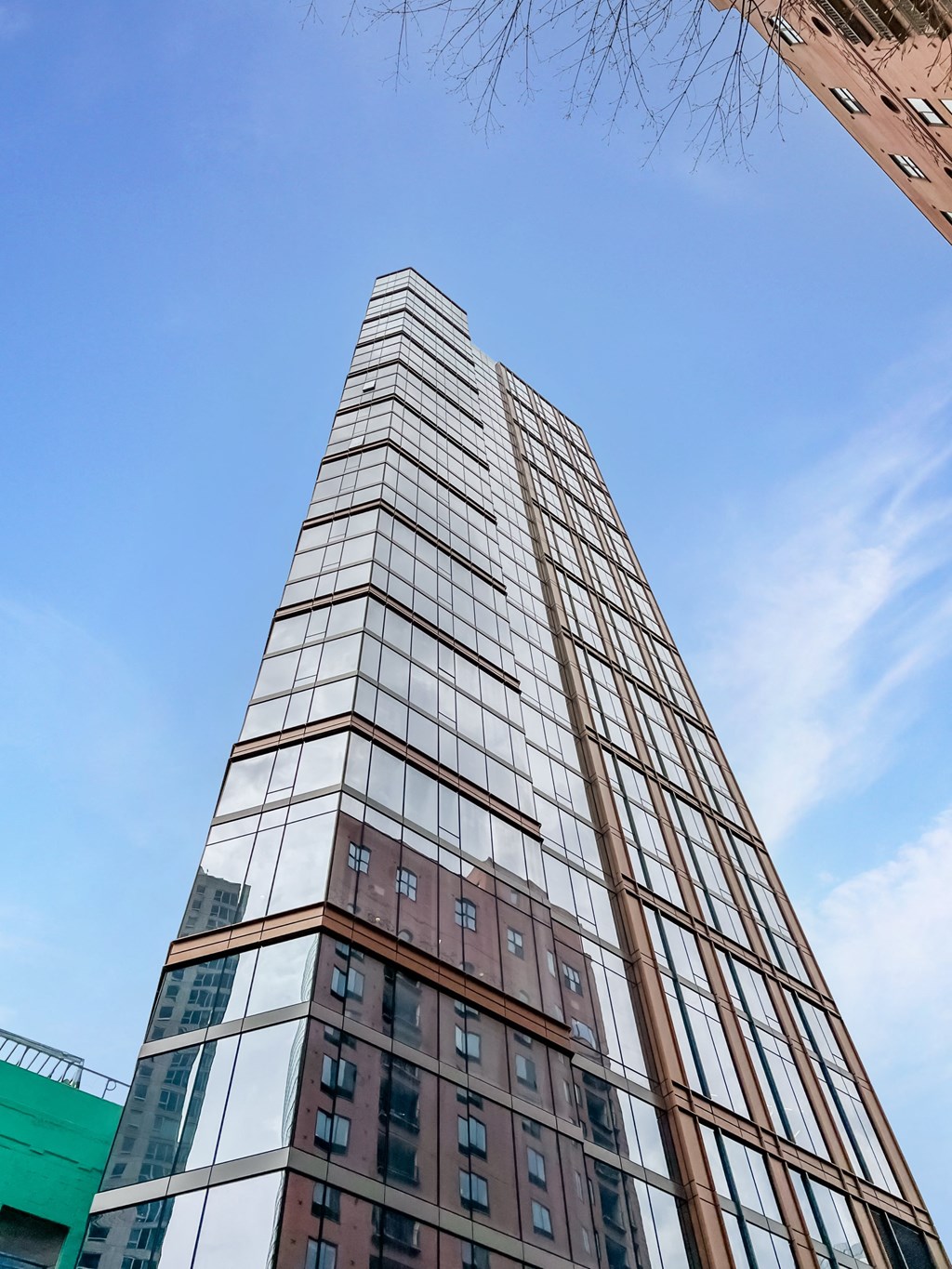 a tall building with a blue sky in the background  at Cassidy on Canal, Chicago, IL, 60654