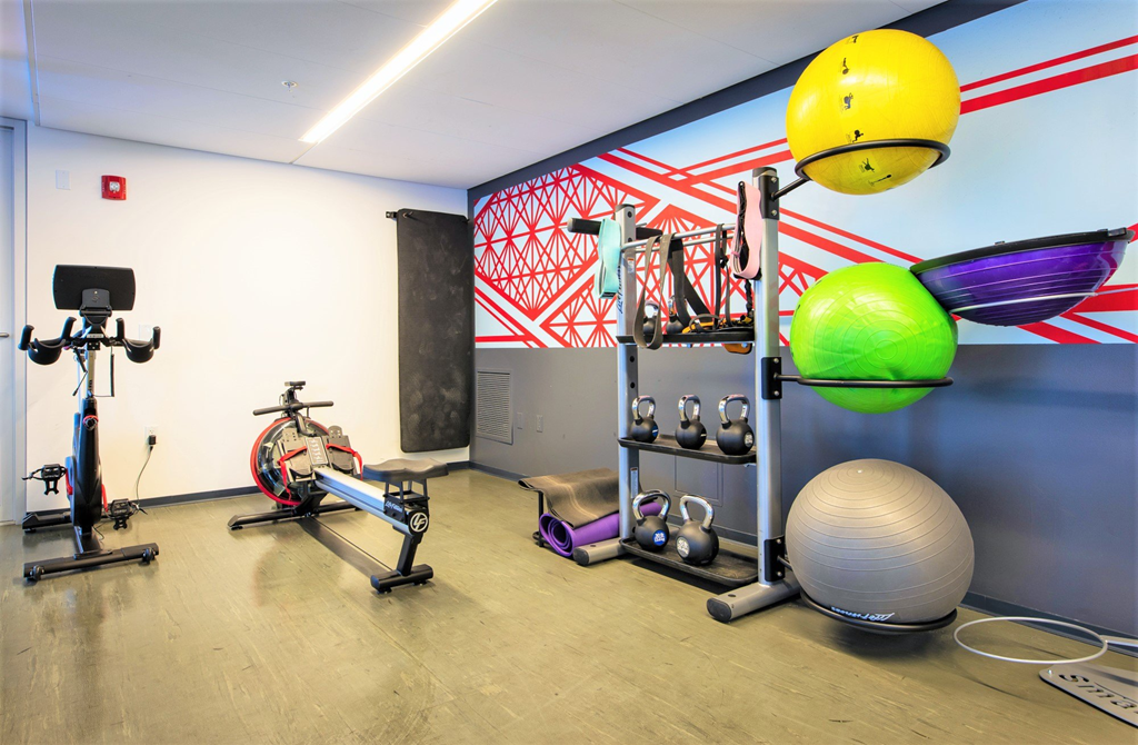 a workout room with weights and other exercise equipment at One 333, Chicago