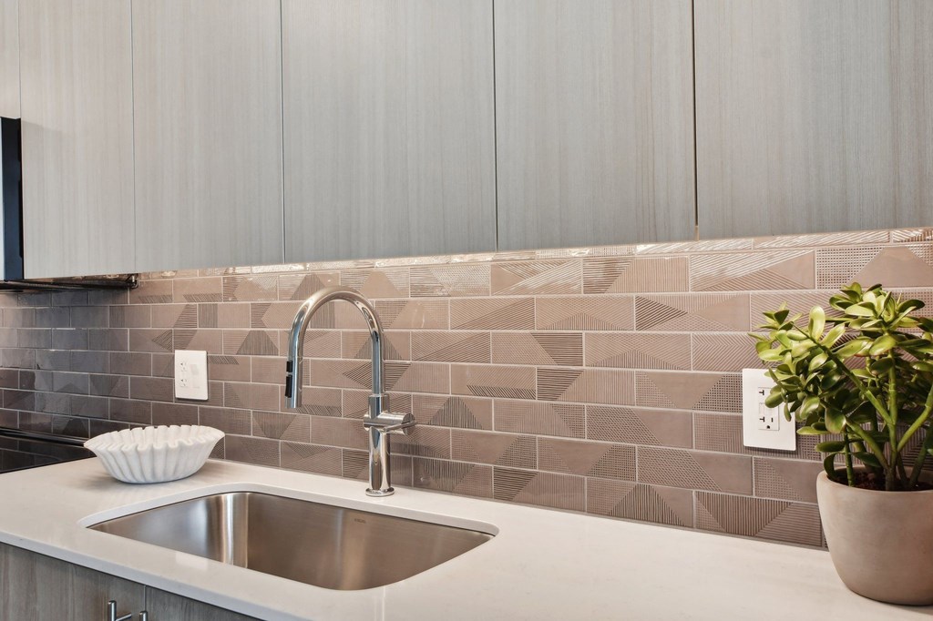a kitchen with a sink and a plant at Cassidy on Canal, Chicago