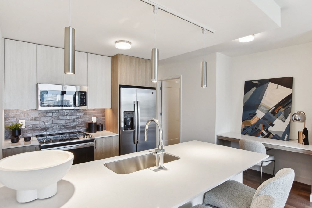 a kitchen with a white counter top and a sink at Cassidy on Canal, Chicago, IL, 60654