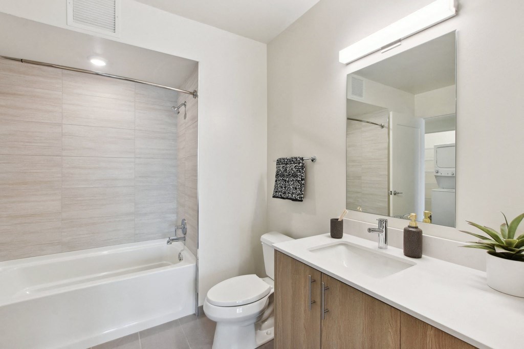 a bathroom with a sink toilet and a bath tub at Cassidy on Canal, Chicago