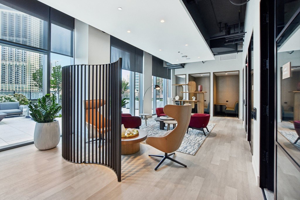 a living room with a large window and a wooden divider at Cassidy on Canal, Chicago