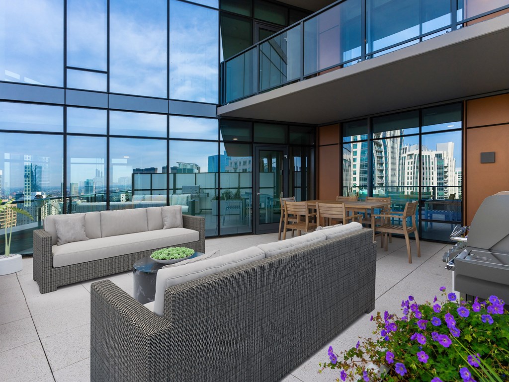 a living room with couches and a table in front of glass walls at Cassidy on Canal, Illinois, 60606