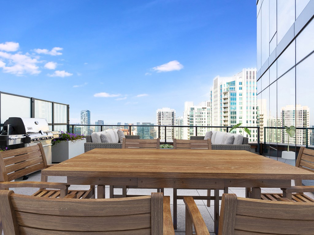 a communal table on a balcony with a view of the city at Cassidy on Canal, Illinois