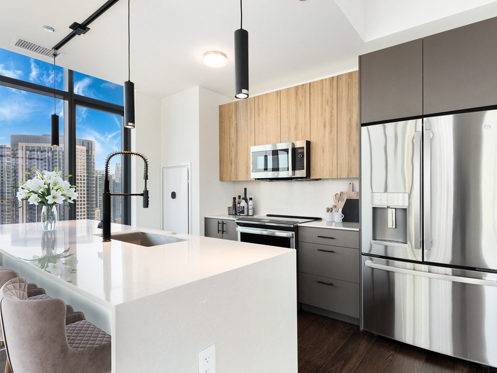a kitchen with a large island and stainless steel appliances at Cassidy on Canal, IL, 60606
