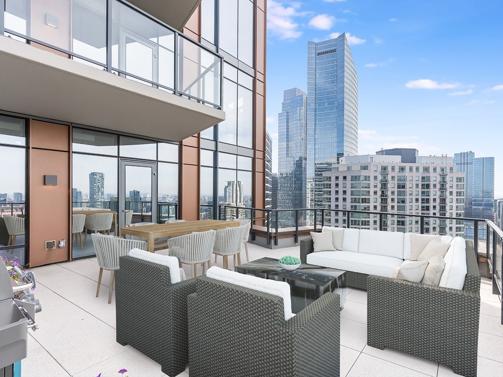 a rendering of a balcony with a couch and chairs and a table at Cassidy on Canal, Chicago, IL, 60606