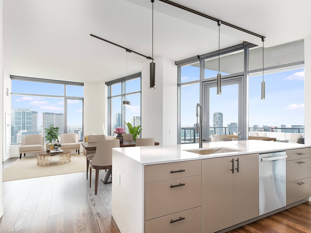 a kitchen and living room with a view of the city at Cassidy on Canal, Chicago, Illinois
