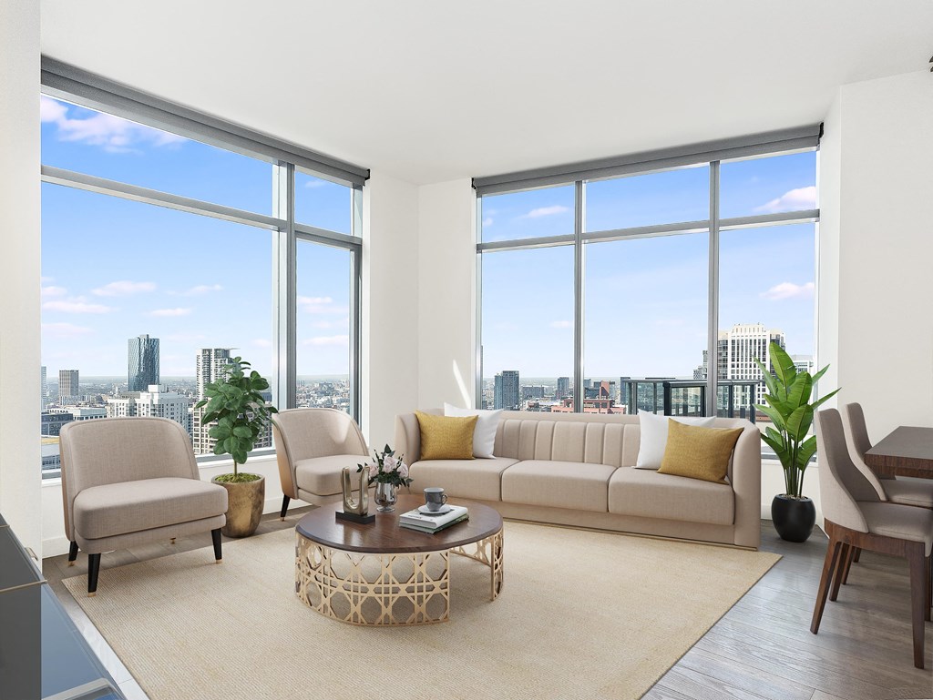 a living room with large windows and a couch and a coffee table at Cassidy on Canal, Chicago, 60606