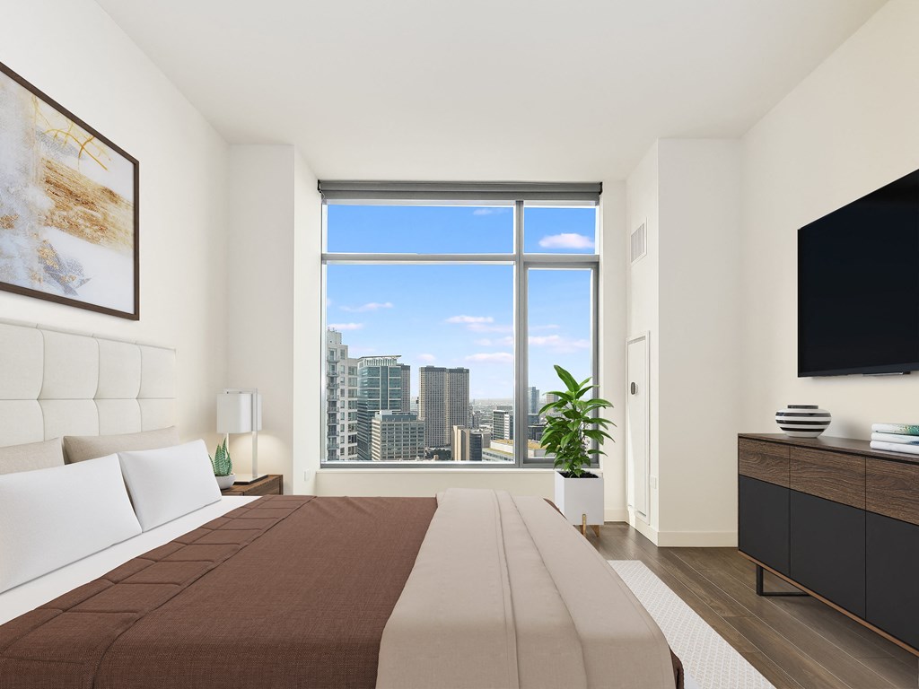 a bedroom with a bed and a large window at Cassidy on Canal, Illinois, 60606