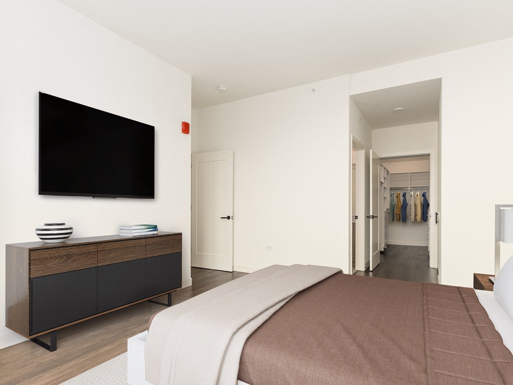 a bedroom with a bed and a tv on the wall at Cassidy on Canal, Chicago, Illinois, 60606