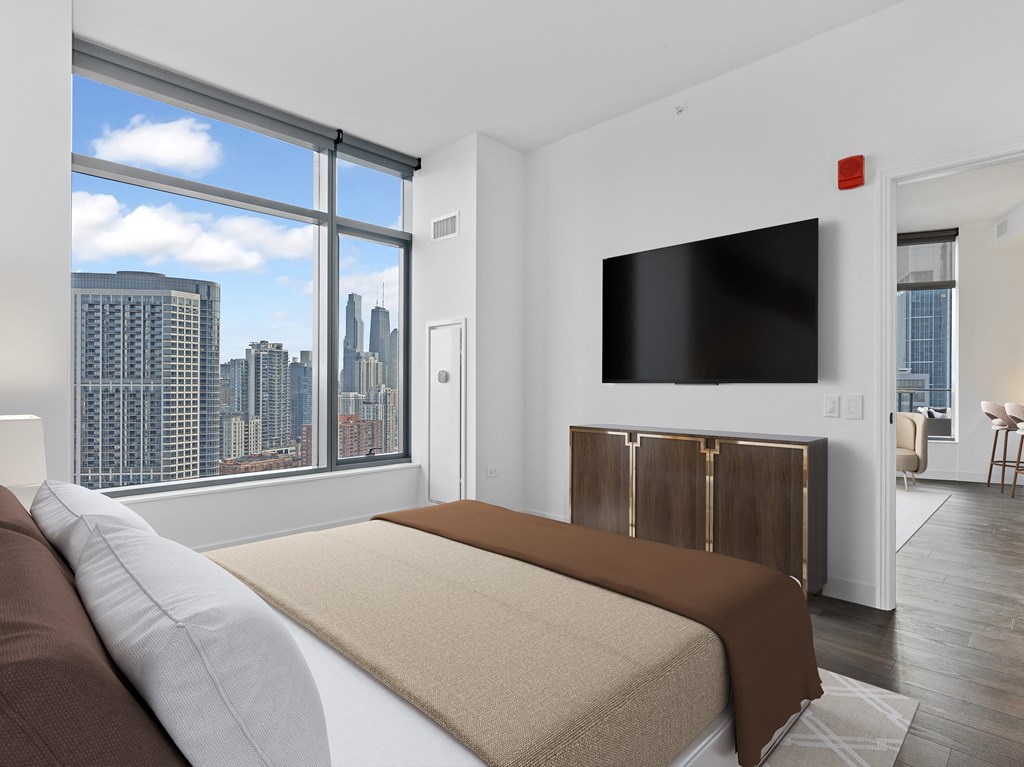 a bedroom with a bed and a large window at Cassidy on Canal, Chicago, IL, 60606