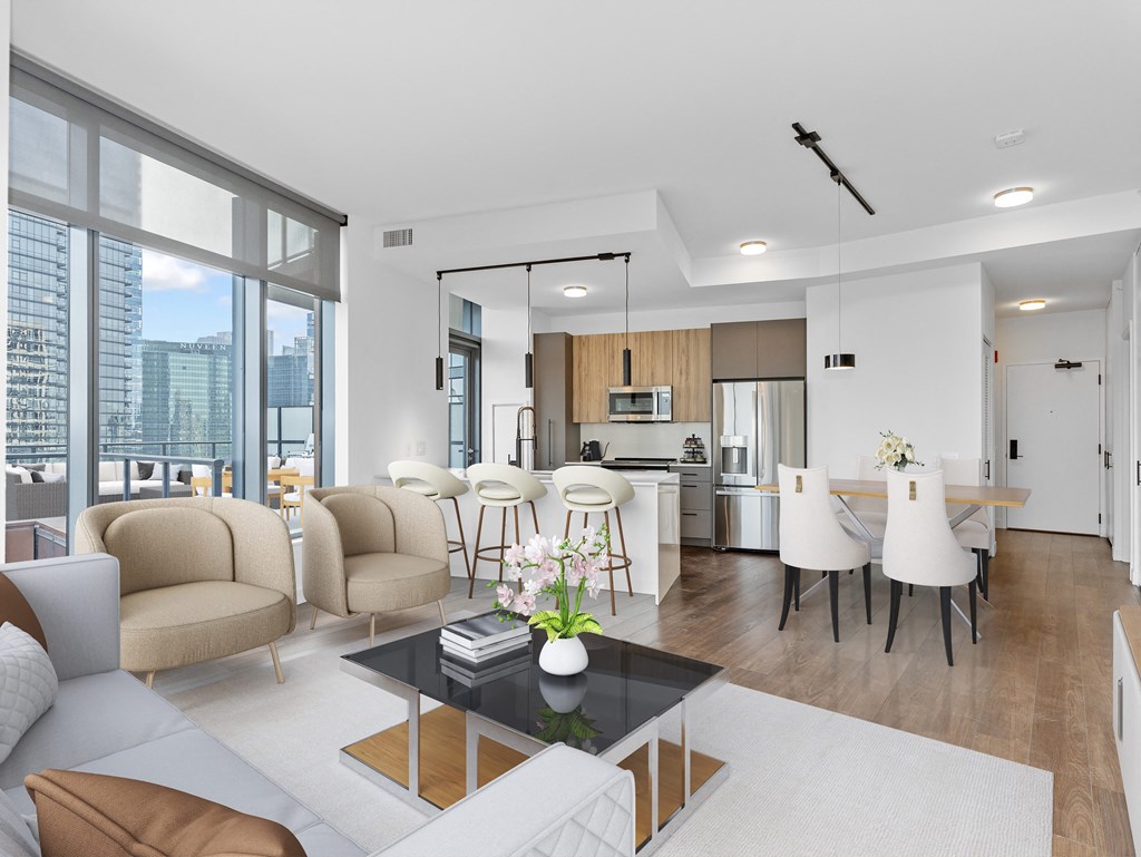 a living room with a couch and a table and a kitchen at Cassidy on Canal, Chicago, 60606