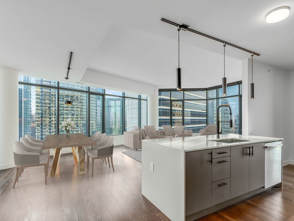 a kitchen and dining area with a large window and a table and chairs at Cassidy on Canal, Chicago, Illinois