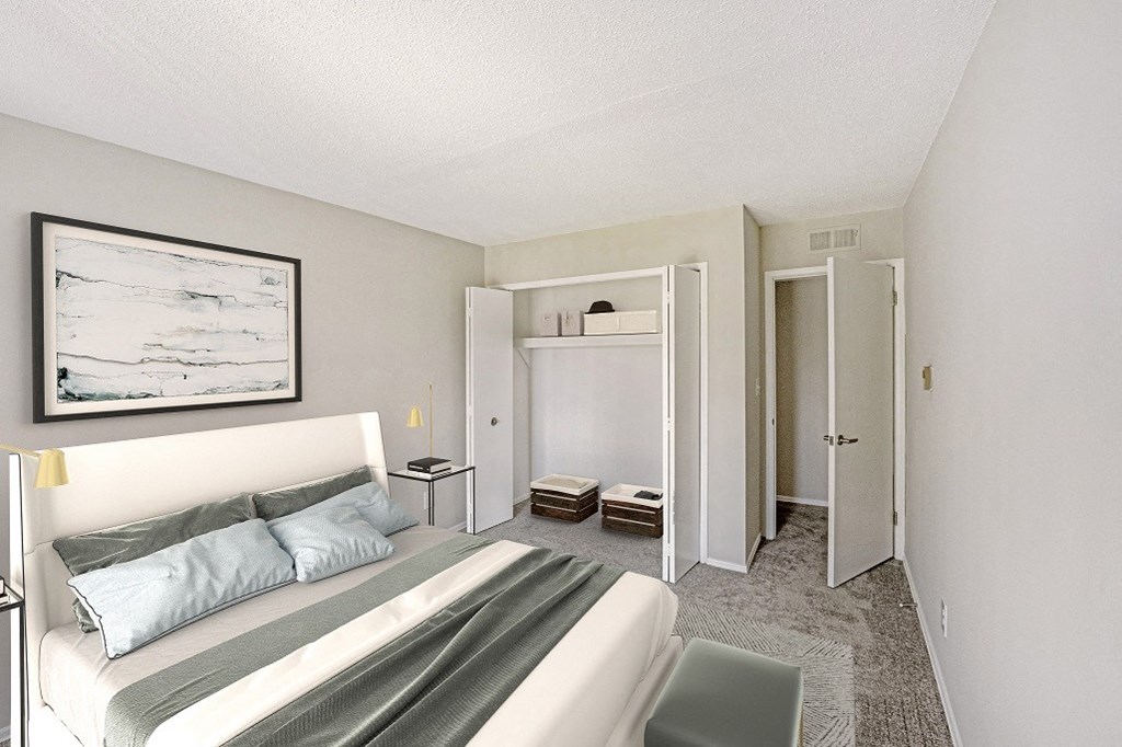 Bedroom with large reach in closet and wall to wall carpet  at The Waverly, Belleville