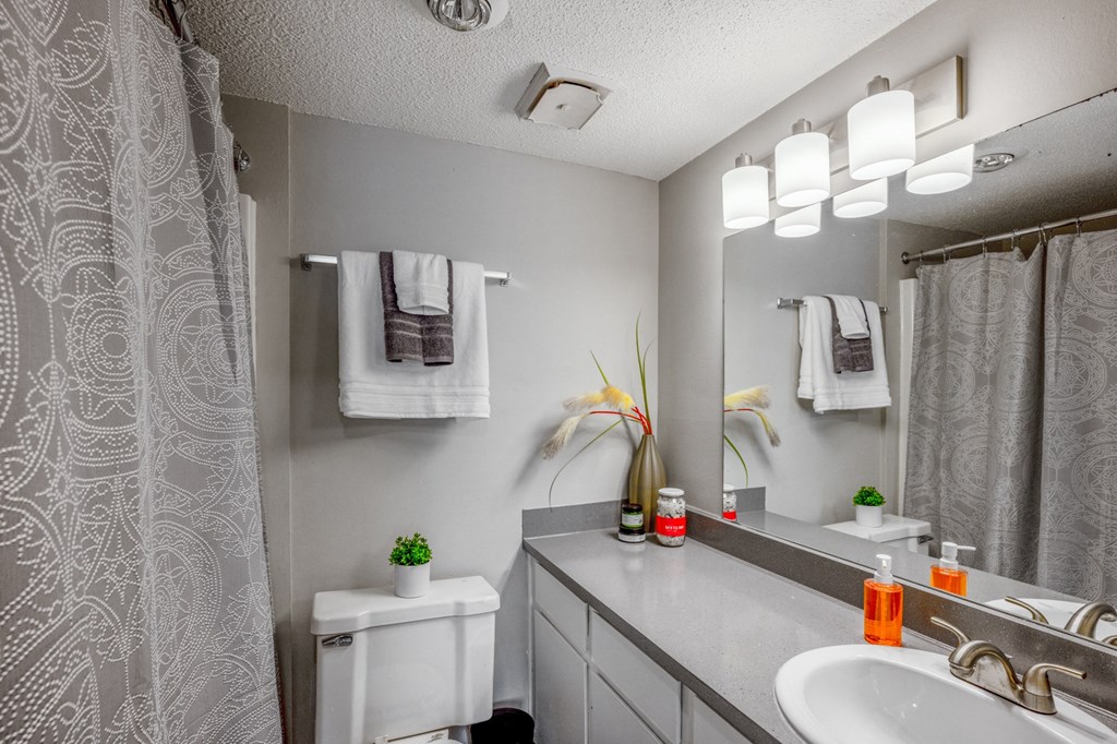 Upgraded bathroom with tub/shower and light colored vanity at The Waverly, Michigan, 48111