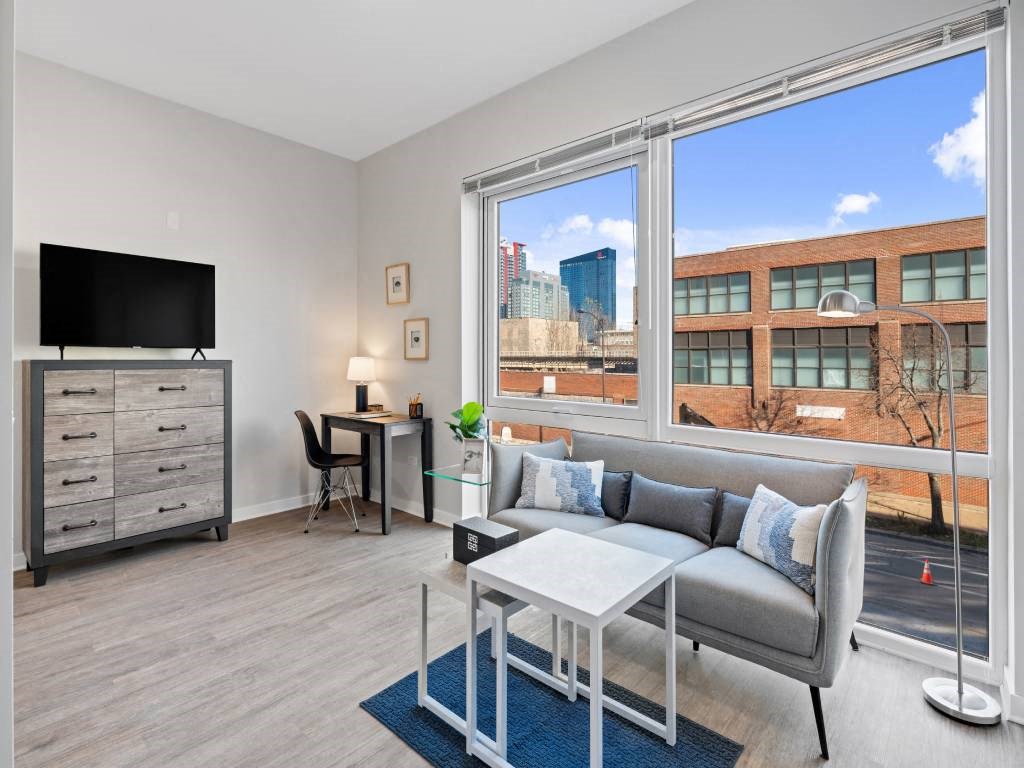 Living Room With TV at 23rd Place Apartment, Chicago, IL