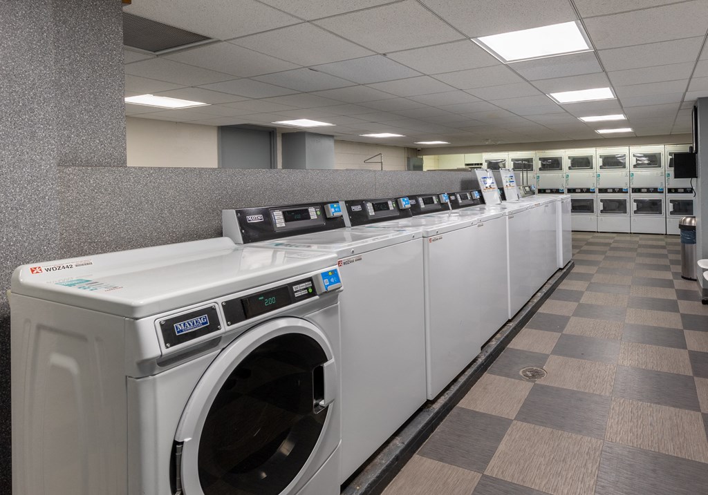a row of washing machines in a public laundromat at The Pavilion, Detroit, MI, 48207