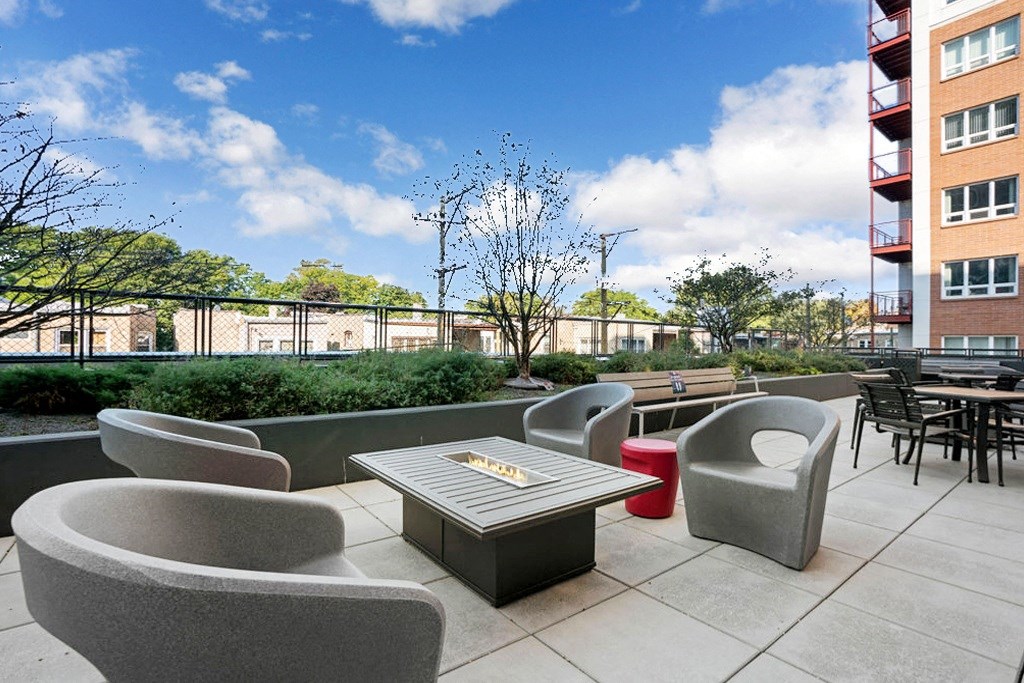 a patio with chairs and a table on a balcony at Concord at Sheridan