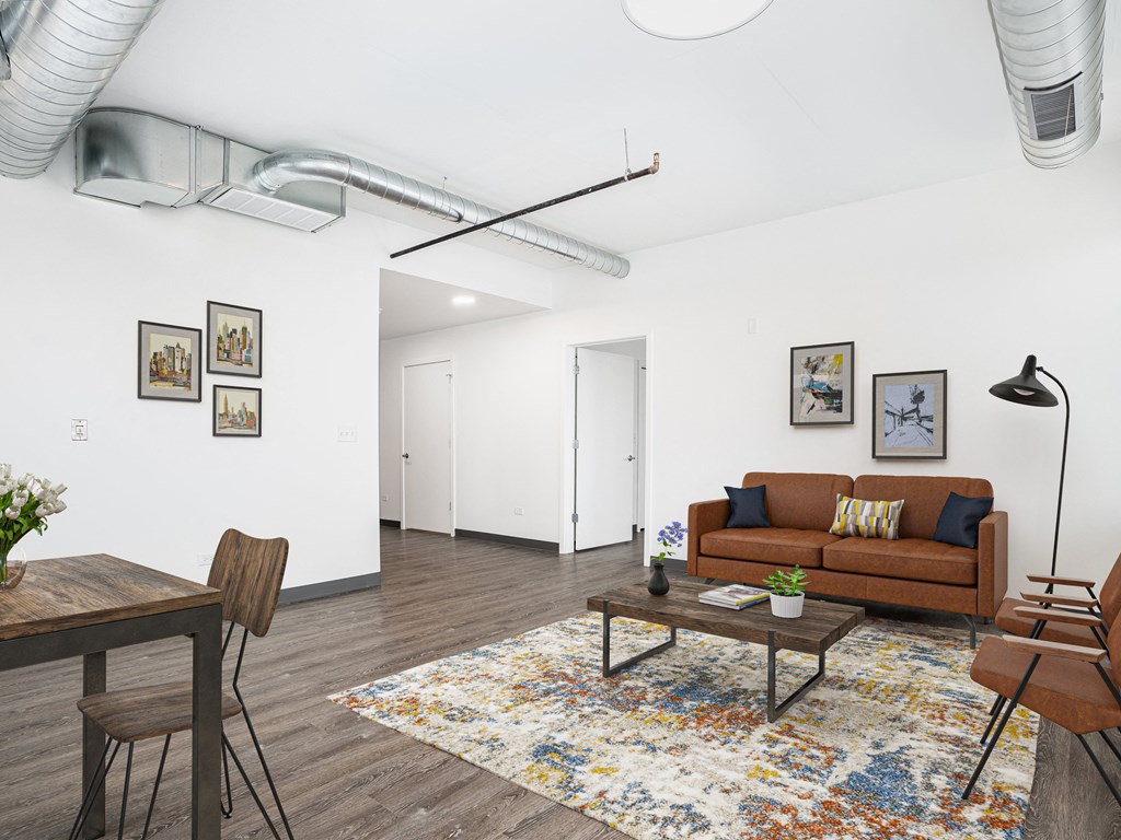 a living room with a couch and a table    and a dining table
