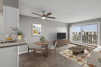 A modern kitchen with a dining table and chairs.
