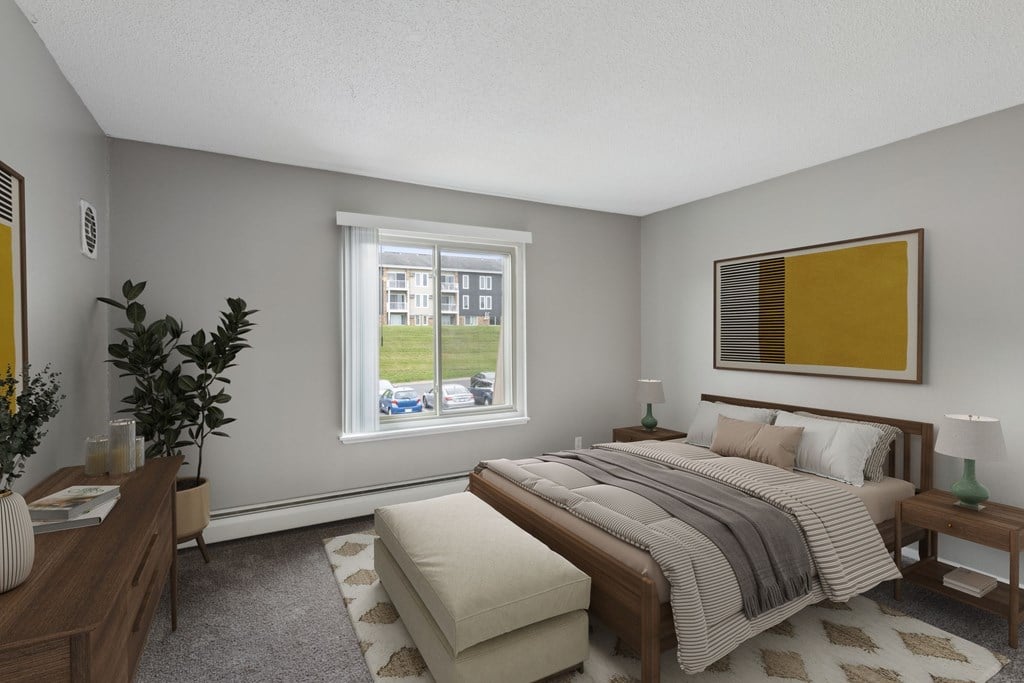 A bedroom with a large bed and a window overlooking a street.