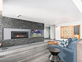 a living room with a fireplace and a couch at One 333, Chicago, Illinois, 60605