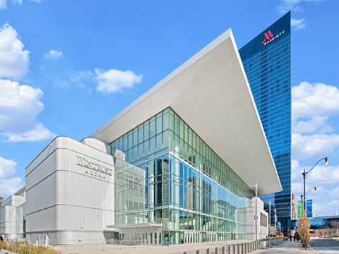 A modern building with a glass facade and a white exterior.
