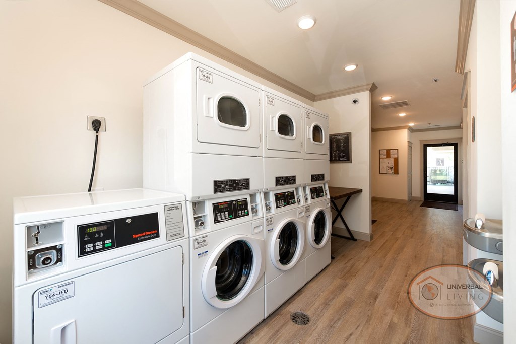 A laundry center with washer, dryer, and table.