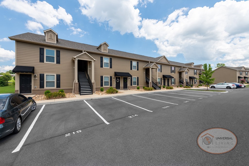 One Bedroom Stacked Apartment Homes with tan siding.