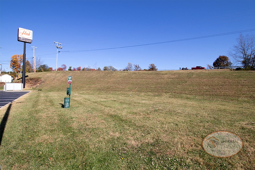 a parking meter in the middle of a field