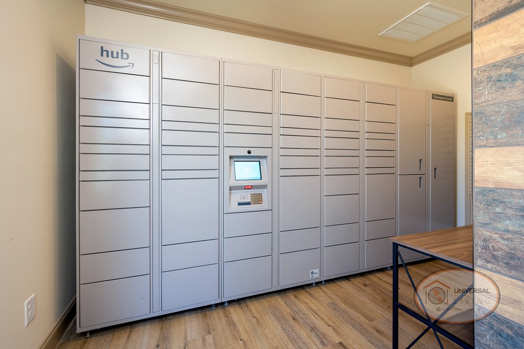The mail center and Amazon hub with lockers and table.