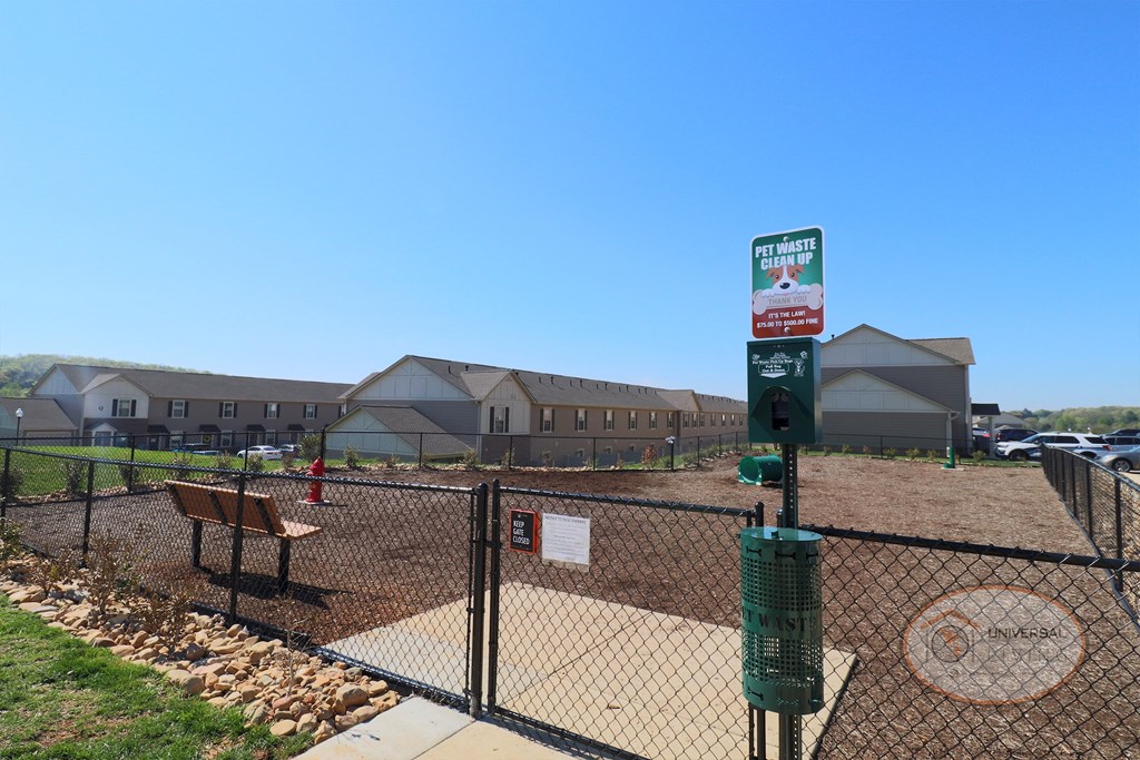 A dog park with seating, water for your dog, and obstacles.