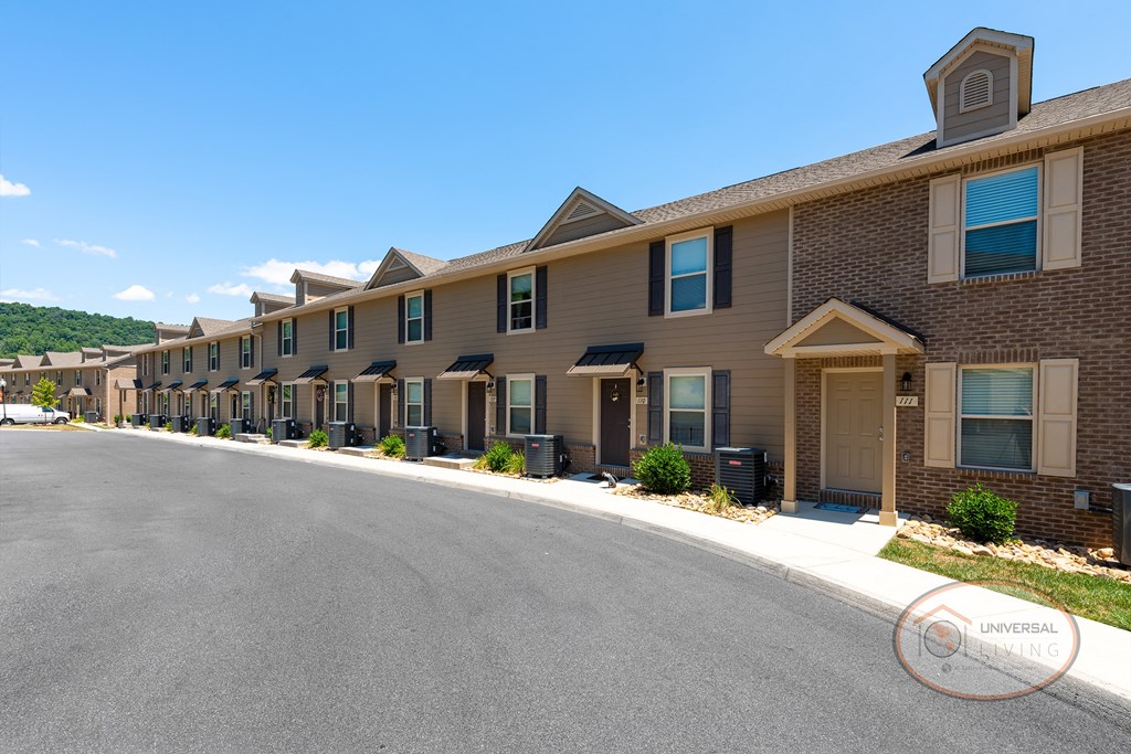 Two bedroom apartment homes with tan siding.