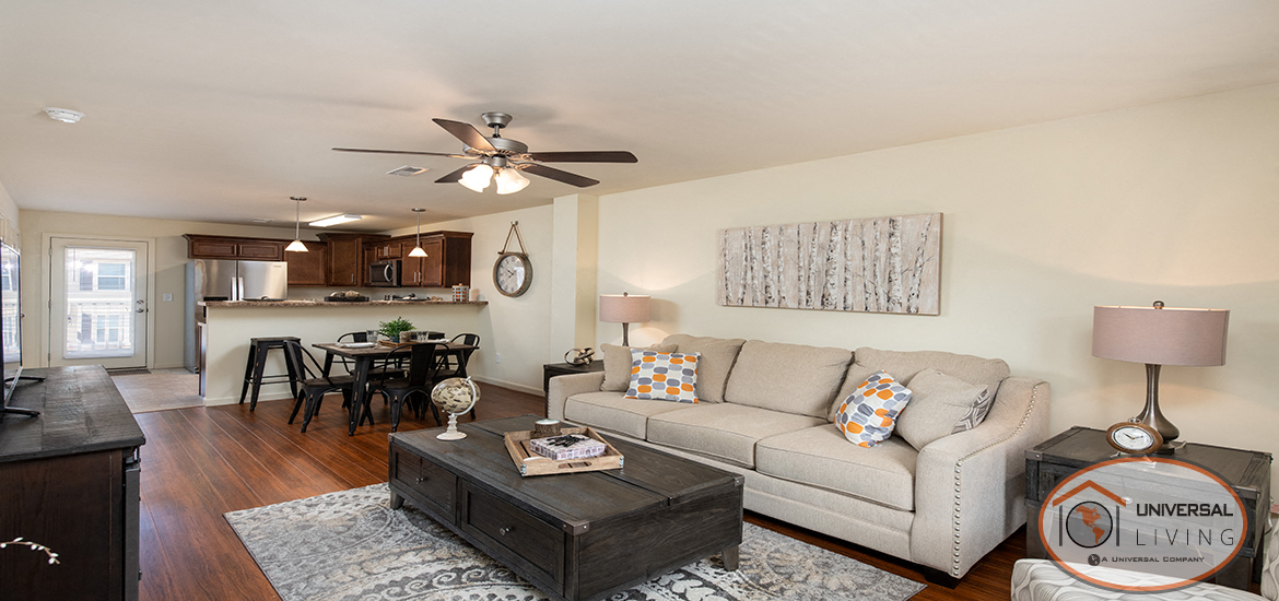 an open living room and kitchen with a couch and a table