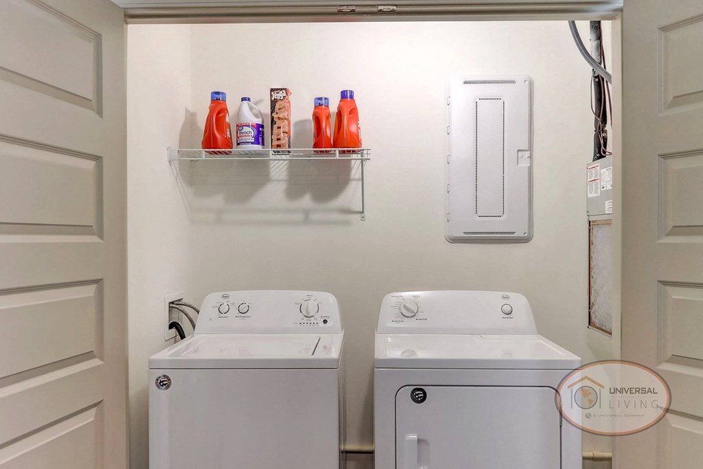 An in-unit laundry room with washer and dryer hookups.