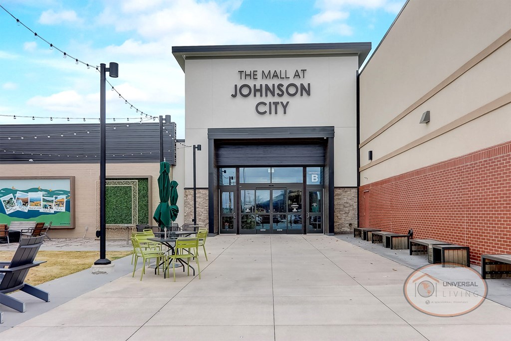 the mall entrance with tables and chairs