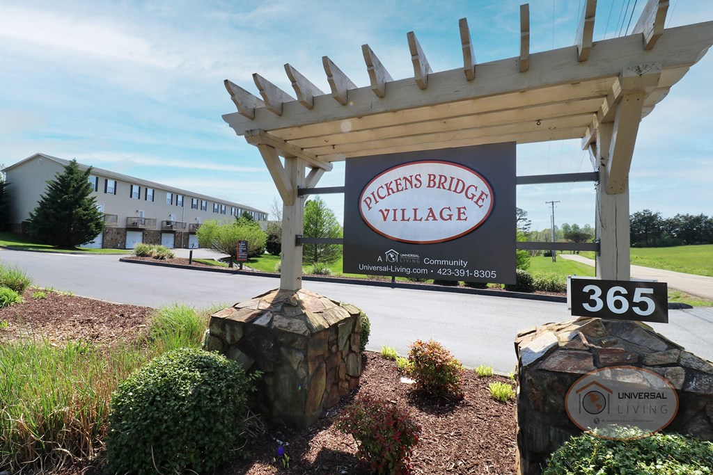A sign that reads "Pickens Bridge Village" sits at the entrance to the property.