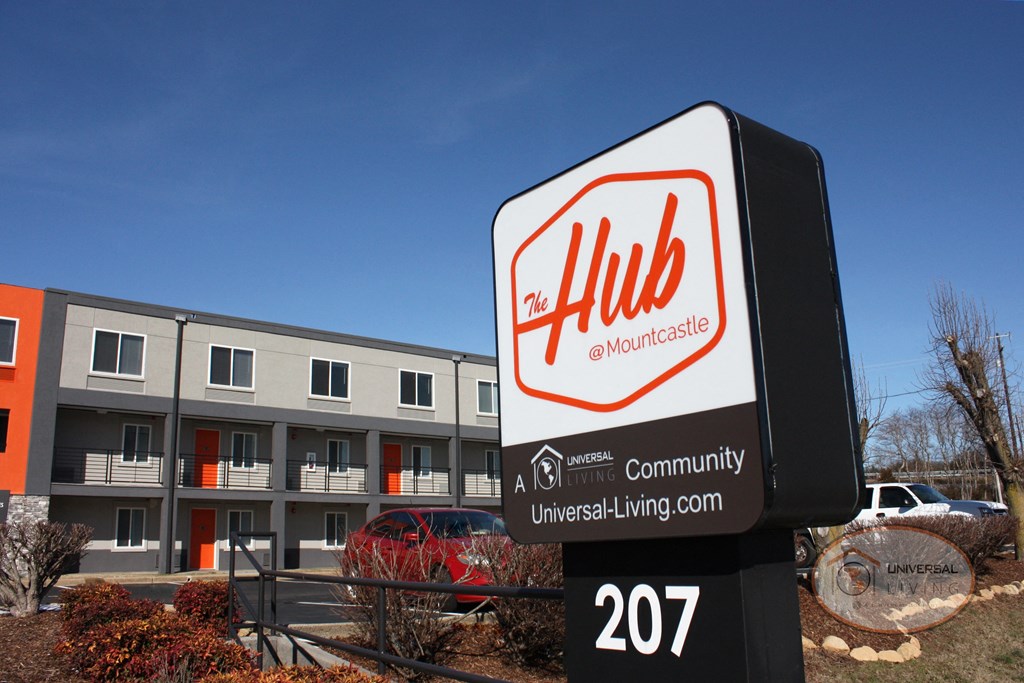 an hhl sign in front of an apartment building