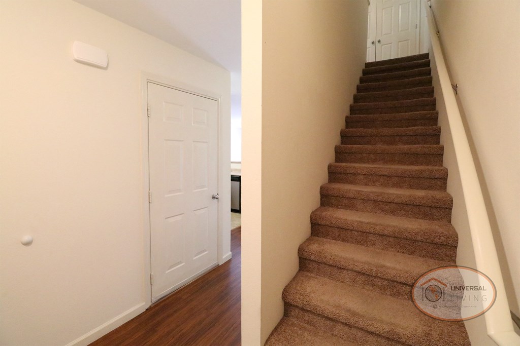 A view of a staircase leading to the second floor from the entrance.