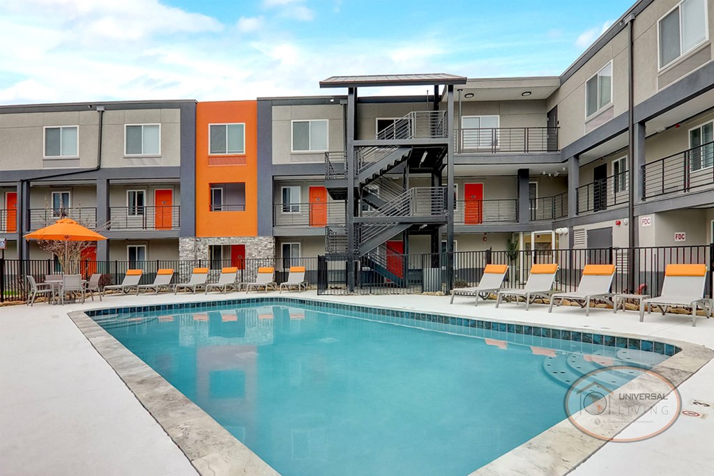 our apartments have a large pool and balconies with chairs