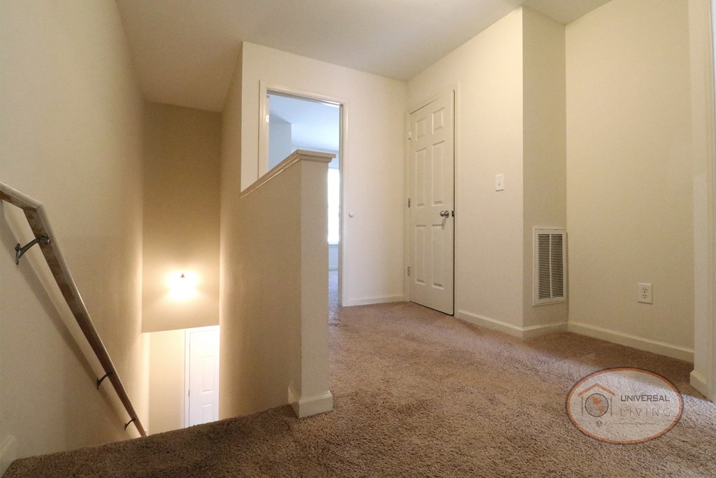 The View of the second bedroom from the top of the stairs.
