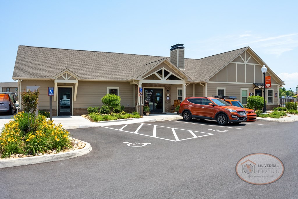 The clubhouse and leasing office with tan siding.