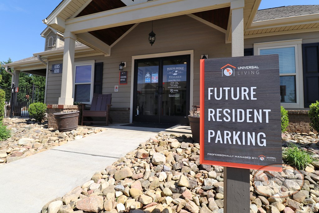 A sign that reads "Future Resident parking" located in front of the clubhouse.