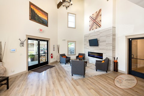 a living room with a fireplace and a door to a patio