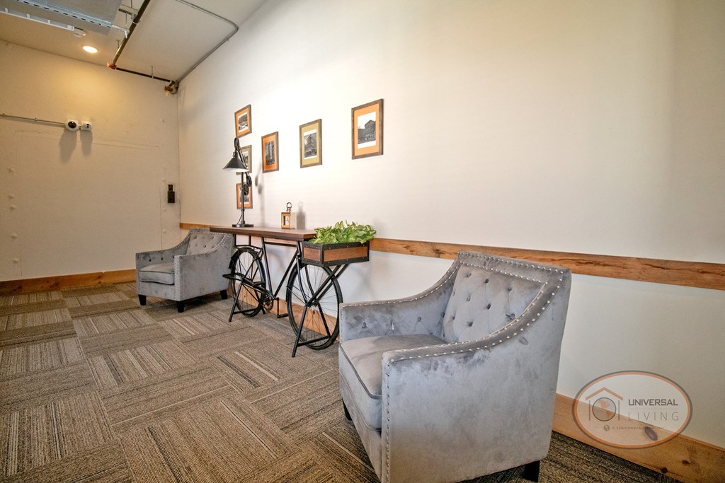The Henry on main lobby with bike table and seating.